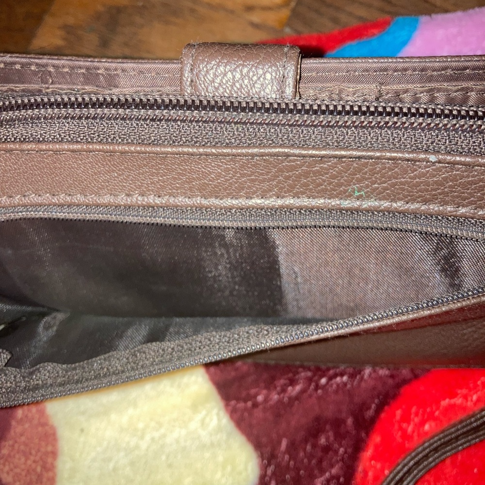Brown wallet with bird details